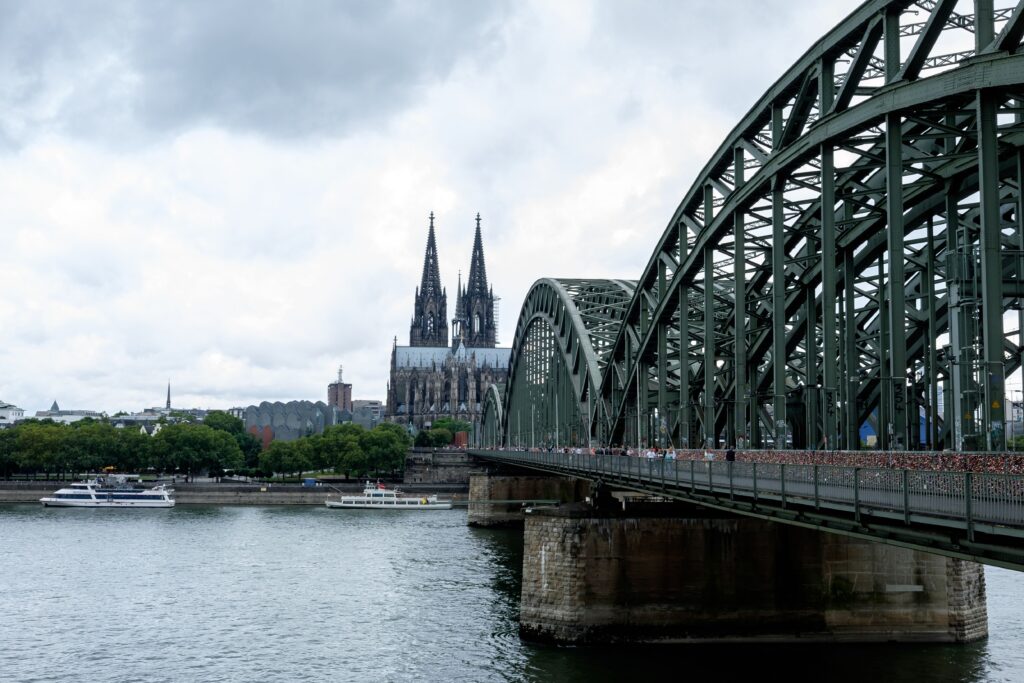 pexels photo 18335862 18335862 Stunning view of Cologne Cathedral and Hohenzollern Bridge over the Rhine River in Germany.
