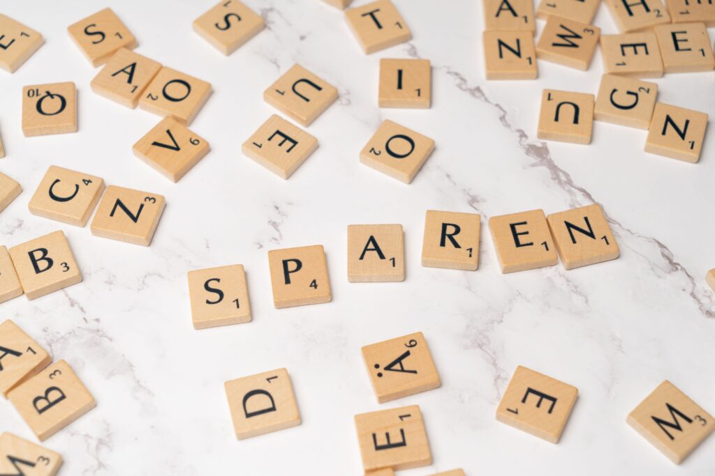 pexels photo 18512940 18512940 Scrabble tiles scattered on a marble surface depicting creativity and wordplay.