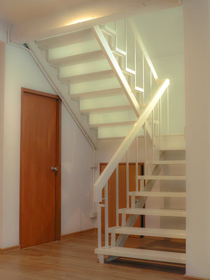 services-01 Clean, contemporary staircase design in a Bangkok residence with natural wooden accents.