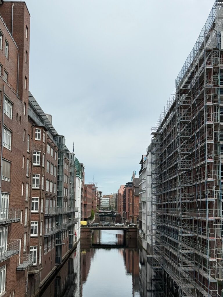 pexels photo 32055039 32055039 A tranquil canal scene with modern and historical buildings in Hamburg, Germany.