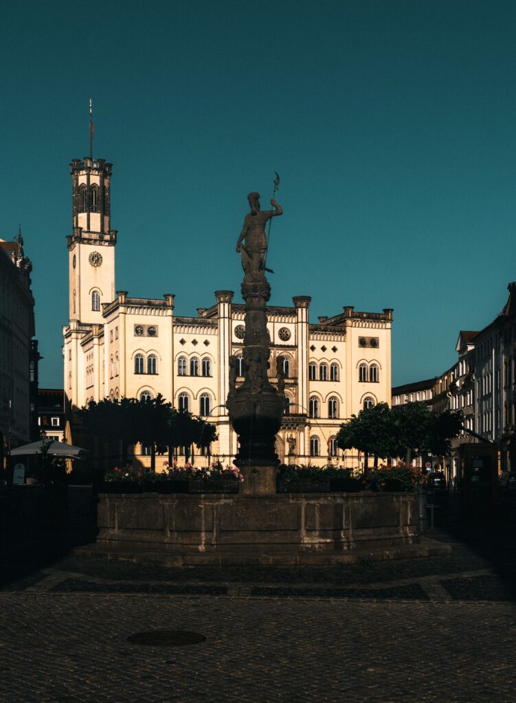 pexels photo 32680985 32680985 Zittau's historic town hall basking in the warm glow of sunset, highlighting its rich architecture.