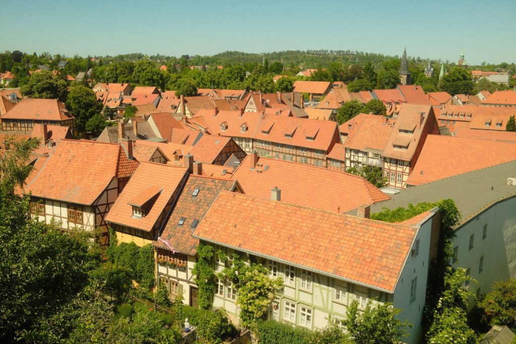 pexels photo 38166511 38166511 Aerial view of historic red-roofed buildings in Quedlinburg, Germany, showcasing traditional architecture.