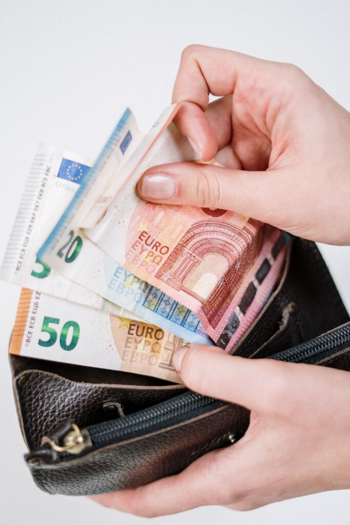 pexels photo 3943740 3943740 Close-up of hands counting euro banknotes from a leather wallet, representing financial transactions.