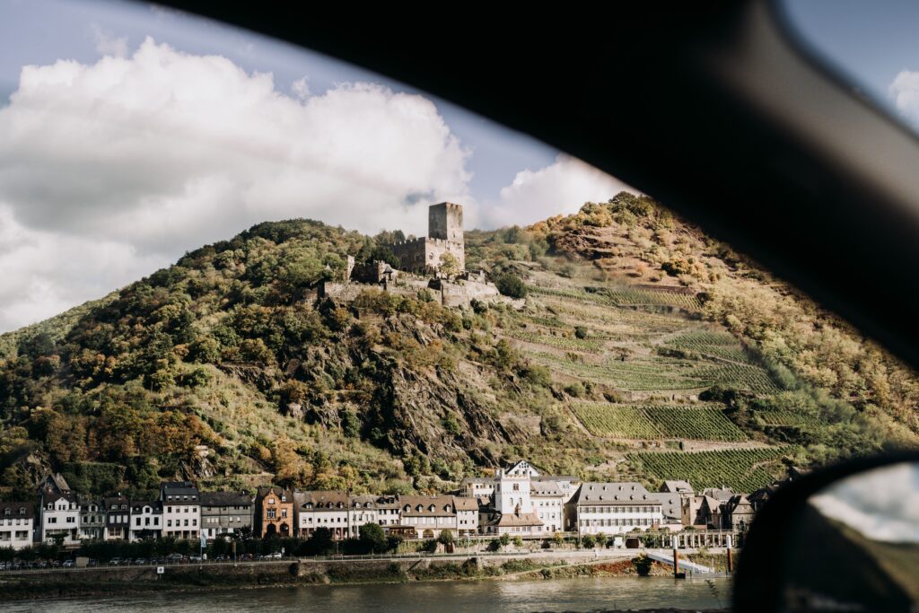 pexels photo 6027627 6027627 Captivating view of a historic Koblenz hill from a car window, showcasing the Rhine Valley.