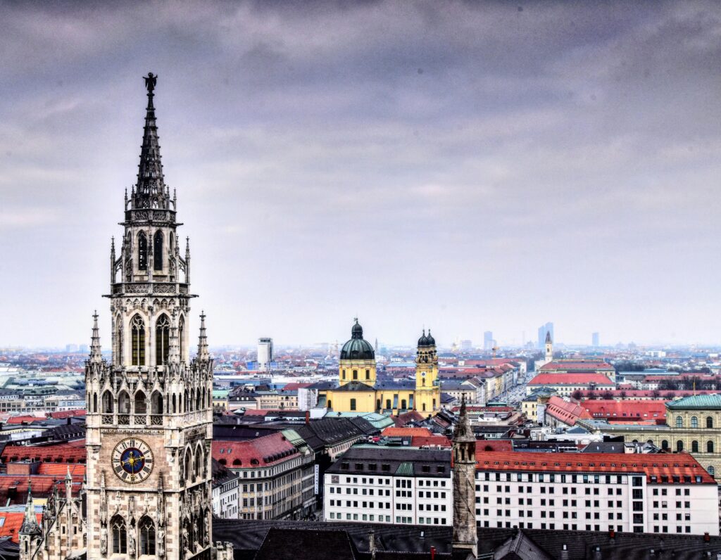 pexels photo 8405804 8405804 Panoramic view of Munich with prominent clock tower and historic buildings.